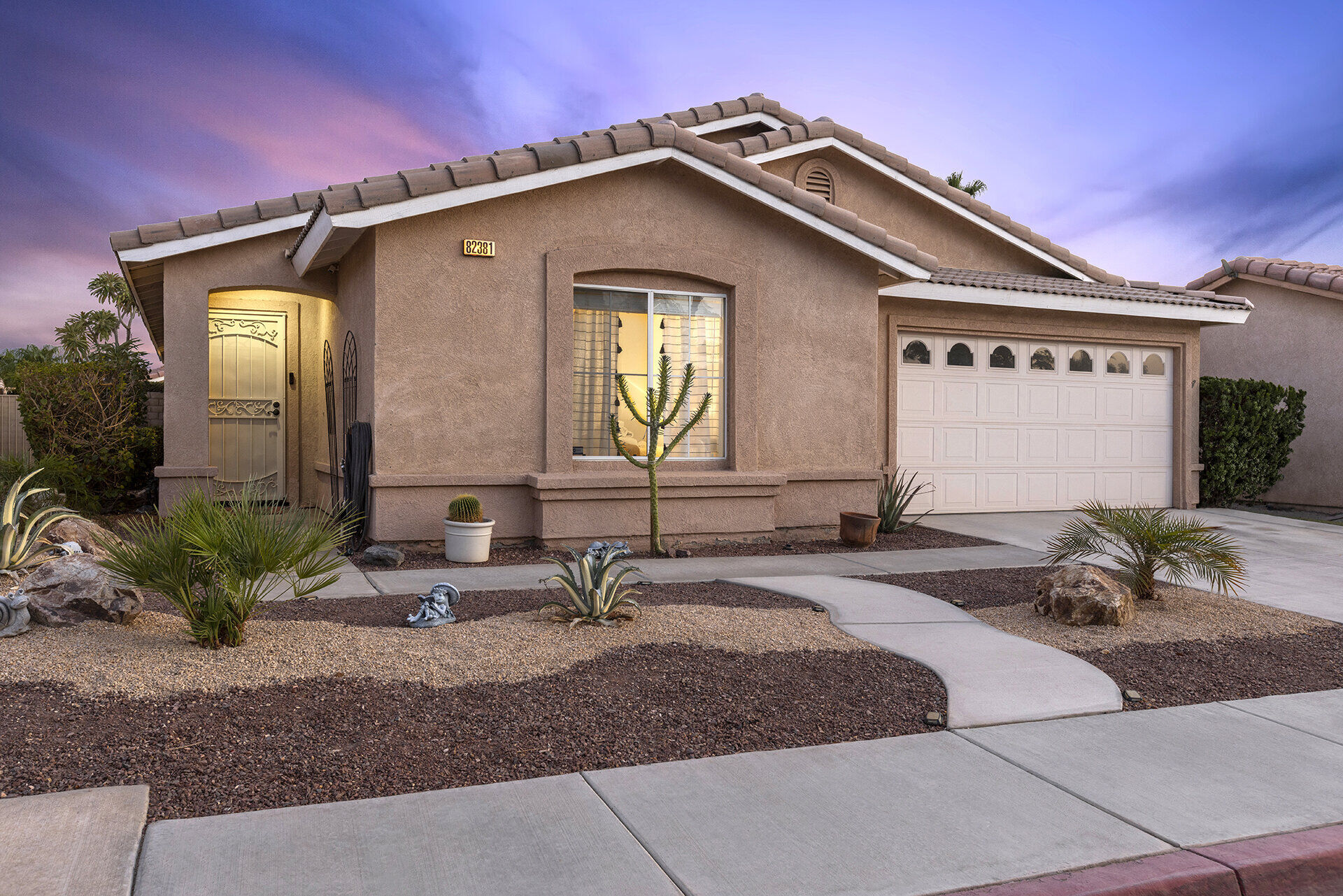 Cozy Cactus poolside patio area with desert landscaping